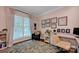 Bright office space with hardwood floors and floral rug, providing a comfortable workspace at 104 Edgewater Park St, Davidson, NC 28036