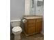 A bathroom with light brown vanity and white toilet at 10672 Barberville Rd, Fort Mill, SC 29707