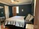 Comfortable bedroom features natural lighting, hardwood floors, and decorative accents at 10672 Barberville Rd, Fort Mill, SC 29707