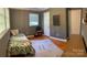 Bedroom features a daybed with a tropical print comforter, and an American sign language chart on the wall at 10672 Barberville Rd, Fort Mill, SC 29707