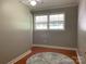 This bedroom features hardwood floors and two windows at 10672 Barberville Rd, Fort Mill, SC 29707