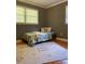 This bedroom features a single bed with jungle themed bedding and a neutral patterned rug at 10672 Barberville Rd, Fort Mill, SC 29707