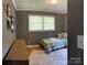 Bright bedroom with tropical bedding, plush rug, and giraffe accent at 10672 Barberville Rd, Fort Mill, SC 29707