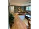 This dining room features a wooden table and chair set, hardwood floors, and decorative wall hangings at 10672 Barberville Rd, Fort Mill, SC 29707