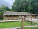 Charming single-story brick home with inviting front porch and wooden railing at 10672 Barberville Rd, Fort Mill, SC 29707