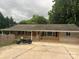 Beautiful home with a welcoming front porch, lovely landscape, and ample parking space at 10672 Barberville Rd, Fort Mill, SC 29707