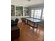 Bright home office with custom built-ins, hardwood floors, a large desk, and ample natural light at 10672 Barberville Rd, Fort Mill, SC 29707