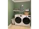 This laundry room features modern, white, side-by-side washer and dryer units at 10672 Barberville Rd, Fort Mill, SC 29707