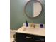 Bathroom featuring a vanity with white countertop, blue accents, and modern brass faucet at 10672 Barberville Rd, Indian Land, SC 29707