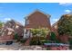 Brick home featuring a cozy backyard with a patio, fire pit, and outdoor dining area at 108 Forrester Ave, Belmont, NC 28012
