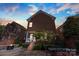 Charming brick home featuring a cozy backyard with a fireplace and outdoor dining area, perfect for entertaining at 108 Forrester Ave, Belmont, NC 28012