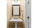 Stylish bathroom features a pedestal sink, framed mirror, and modern fixtures at 108 Forrester Ave, Belmont, NC 28012