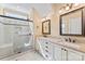 Bathroom featuring frameless shower and double vanity with granite countertop and neutral sinks at 108 Forrester Ave, Belmont, NC 28012