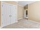 Bedroom offers neutral carpet, trim, closet, and natural light at 108 Forrester Ave, Belmont, NC 28012