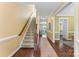 Inviting foyer with hardwood floors, staircase, and a view leading to the living spaces at 108 Forrester Ave, Belmont, NC 28012