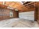 Spacious garage featuring ample storage space and an overhead door at 108 Forrester Ave, Belmont, NC 28012