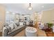 Open-concept living space featuring a modern kitchen, comfortable seating, and elegant decor at 108 Forrester Ave, Belmont, NC 28012