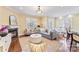 Bright and inviting living room featuring a fireplace, comfortable seating, and ample natural light at 108 Forrester Ave, Belmont, NC 28012