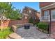 Relaxing brick patio with a fire pit and cushioned seating creates a cozy outdoor space at 108 Forrester Ave, Belmont, NC 28012