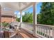 Inviting covered porch with wicker furniture and a ceiling fan at 108 Forrester Ave, Belmont, NC 28012