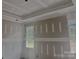 Spacious bedroom featuring fresh drywall, white trim, and bright natural light at 1143 Journey Ln, Salisbury, NC 28146