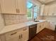 Bright kitchen features white cabinets, stainless steel appliances, white subway tile backsplash and hardwood floors at 1143 Journey Ln, Salisbury, NC 28146
