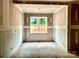 Well-lit living room showcasing fresh drywall, white trim and a beautiful window view at 1143 Journey Ln, Salisbury, NC 28146