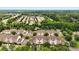 Aerial view of a well-planned community with lush landscaping, winding roads, and diverse architectural styles at 11911 Ridgeway Park Dr, Charlotte, NC 28277