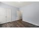 This bedroom features wood floors and a spacious closet at 11911 Ridgeway Park Dr, Charlotte, NC 28277