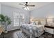 Bedroom featuring a decorative rug and a large bright window at 11911 Ridgeway Park Dr, Charlotte, NC 28277