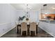 Spacious dining room with a contemporary chandelier and dark hardwood floors at 11911 Ridgeway Park Dr, Charlotte, NC 28277