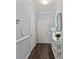 Bright hallway with dark floors and decorative table with a lamp at 11911 Ridgeway Park Dr, Charlotte, NC 28277