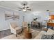 Comfortable living room showcasing neutral color palette and seamless view into dining room at 11911 Ridgeway Park Dr, Charlotte, NC 28277