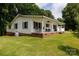 A charming single-story home with a covered front porch, lush lawn, and mature trees surrounding the property at 1197 Fincher Rd, Fort Lawn, SC 29714