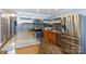 Updated kitchen featuring stainless steel appliances, granite countertops, a mosaic backsplash, and tile floors at 1197 Fincher Rd, Fort Lawn, SC 29714