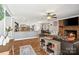Open concept living room with fireplace flows to a dining area and modern kitchen with stainless appliances at 1197 Fincher Rd, Fort Lawn, SC 29714