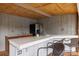 Outdoor kitchen with counter seating, sink, and refrigerator at 1197 Fincher Rd, Fort Lawn, SC 29714