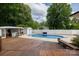 Stunning backyard oasis with pool, deck, and bar area for ultimate enjoyment at 1197 Fincher Rd, Fort Lawn, SC 29714