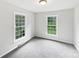 Bright bedroom with two large windows and neutral carpeting at 1224 Bethlehem Rd, Kings Mountain, NC 28086
