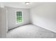 Cozy bedroom features plush carpeting, neutral walls, and a sunlit window at 1224 Bethlehem Rd, Kings Mountain, NC 28086