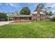 Charming two-story brick home with black shutters and a well-maintained front yard at 1224 Bethlehem Rd, Kings Mountain, NC 28086