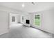 Spacious living room featuring neutral carpet and a brick fireplace at 1224 Bethlehem Rd, Kings Mountain, NC 28086