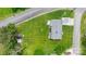 Top-down aerial shows a home with a big yard, carport, and various outbuildings at 1266 18Th Ne St, Hickory, NC 28601