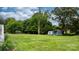 Wide, open, green backyard featuring lush green trees and various storage buildings at 1266 18Th Ne St, Hickory, NC 28601
