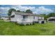 Home with a spacious backyard and a white porch ideal for relaxing at 1266 18Th Ne St, Hickory, NC 28601