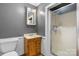 Simple bathroom featuring a small sink, toilet, and stand-up shower at 1266 18Th Ne St, Hickory, NC 28601