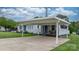 Charming single-story home with carport, manicured lawn, and welcoming entrance at 1266 18Th Ne St, Hickory, NC 28601