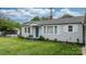 Charming single-story home with well-manicured lawn and updated gray siding at 1266 18Th Ne St, Hickory, NC 28601