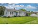 Charming single-story home with well-manicured lawn, covered parking and updated gray siding at 1266 18Th Ne St, Hickory, NC 28601