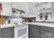 Cozy kitchen featuring white appliances, gray cabinets and a white countertop at 1266 18Th Ne St, Hickory, NC 28601